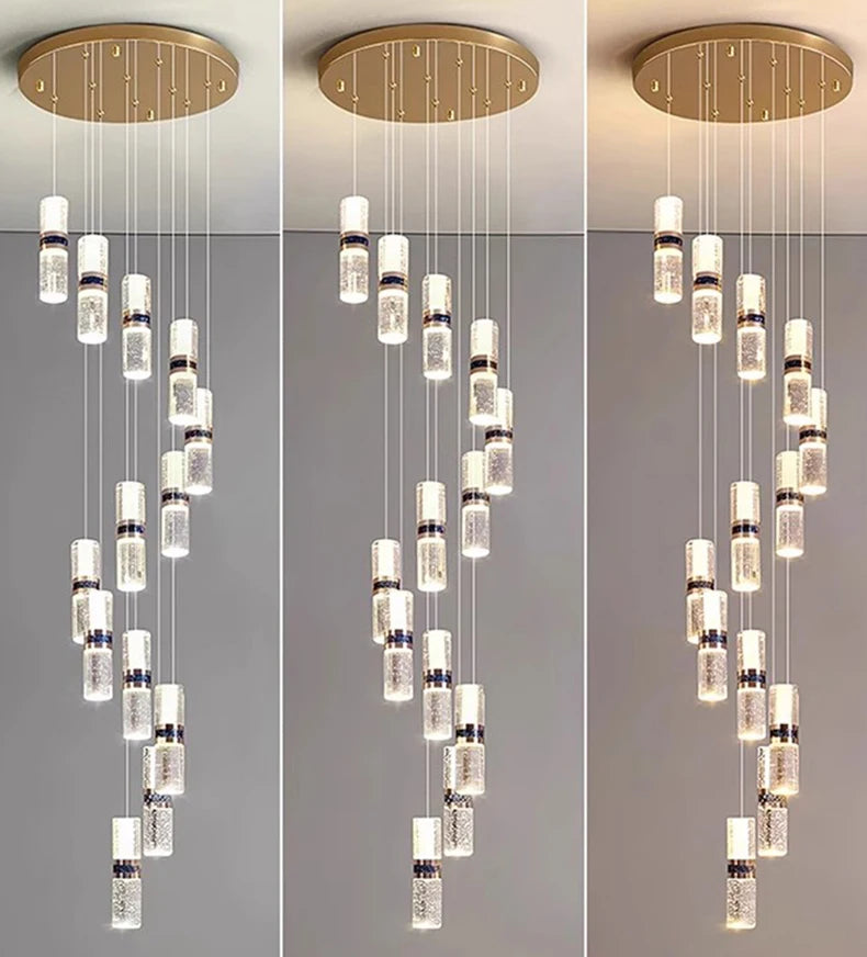 Modern crystal pendant light with gold ceiling mount and cascading cylindrical fixtures for contemporary interiors