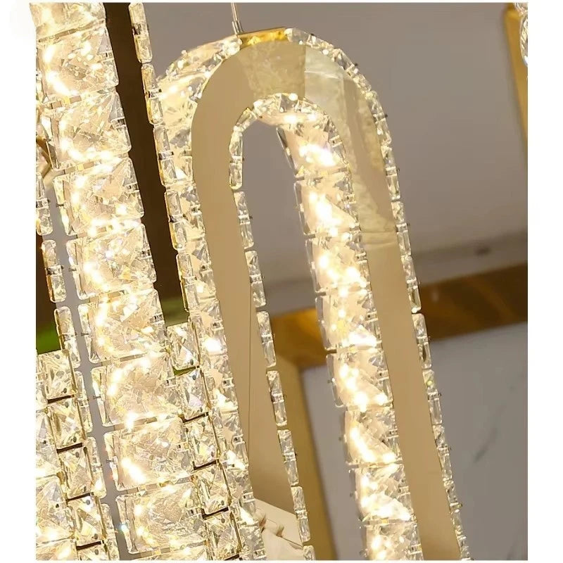 Luxury crystal chandelier with gold frame and warm LED lights for modern interior lighting