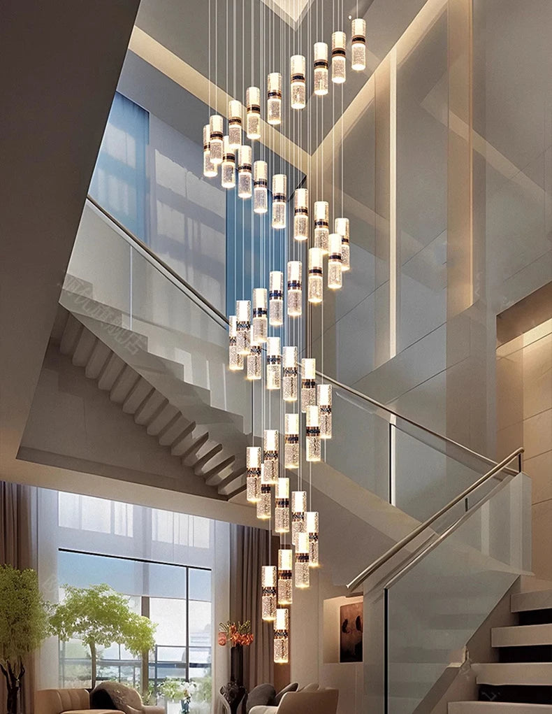 Modern spiral chandelier with crystal accents illuminating a luxury staircase and living area