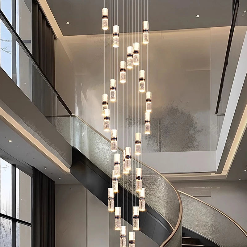 Modern crystal pendant chandelier over spiral staircase, luxury interior lighting design