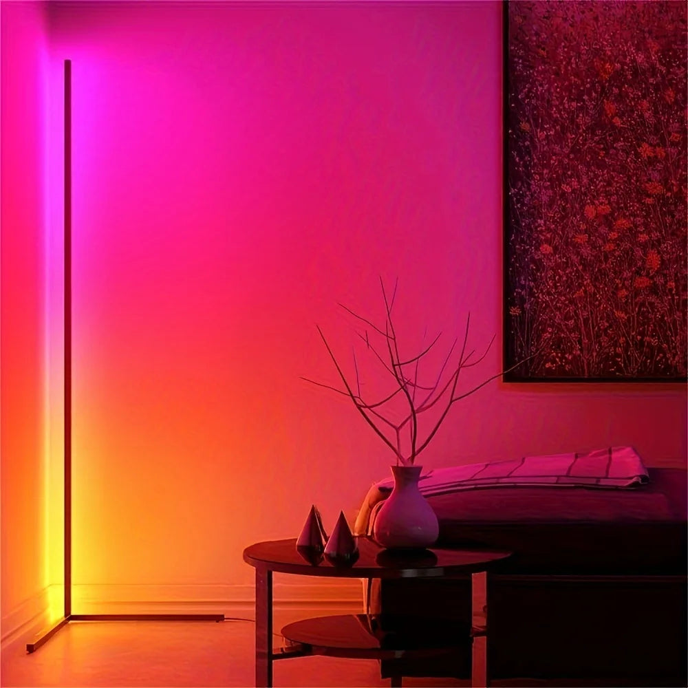 Room interior with a gradient wall light, table with decorative items, and abstract painting.