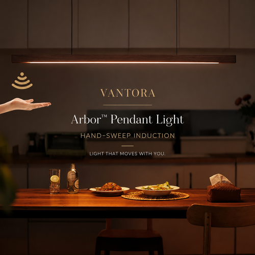 Vantara Arbor Pendant Light in a modern kitchen setting, featuring a warm LED light bar suspended over a wooden dining table with food and drinks, with a hand reaching toward the light.