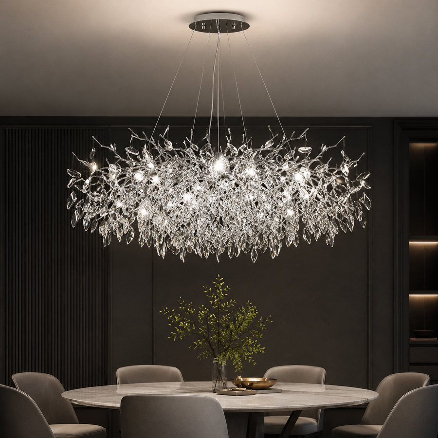 Modern crystal chandelier with leaf-like design over dining table, elegant lighting for contemporary interiors