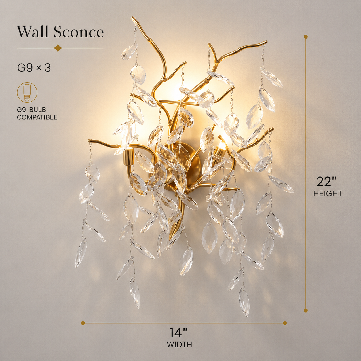 Wall sconce with gold branches and crystal accents on a light gray background