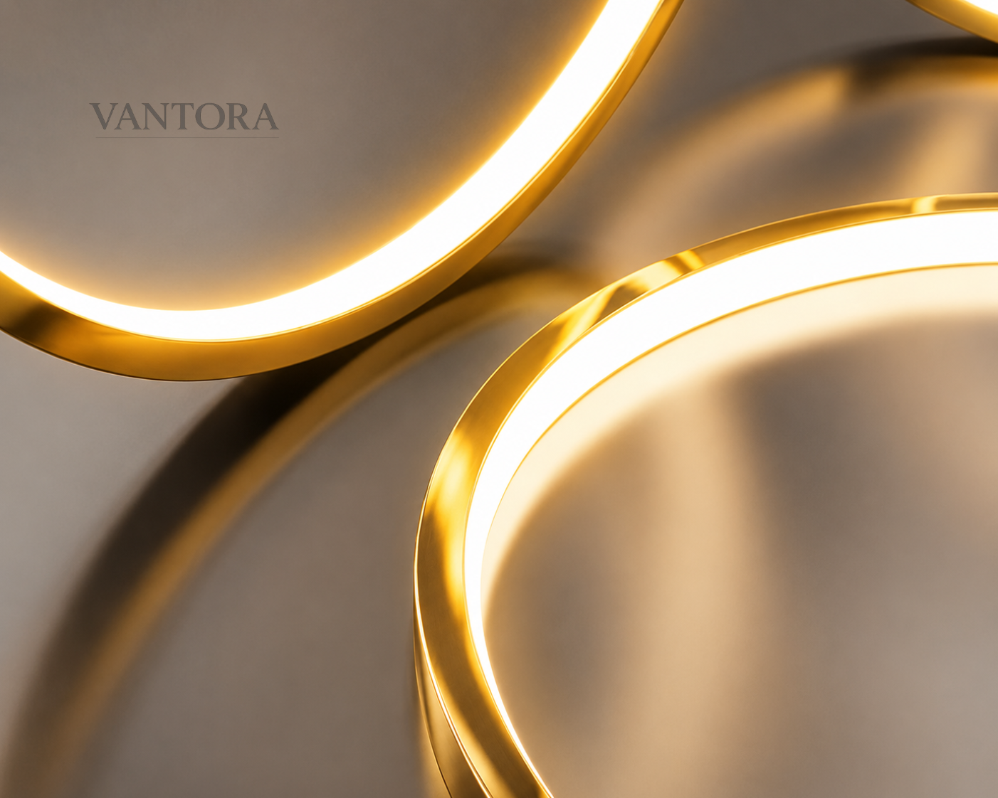 Two gold circular lights with a blurred background, featuring the brand 'Vantora'.
