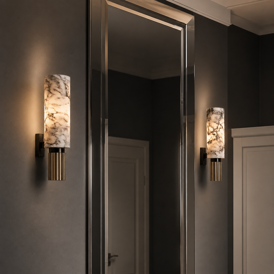 Marble-textured wall sconce with gold base, modern bathroom lighting beside mirror