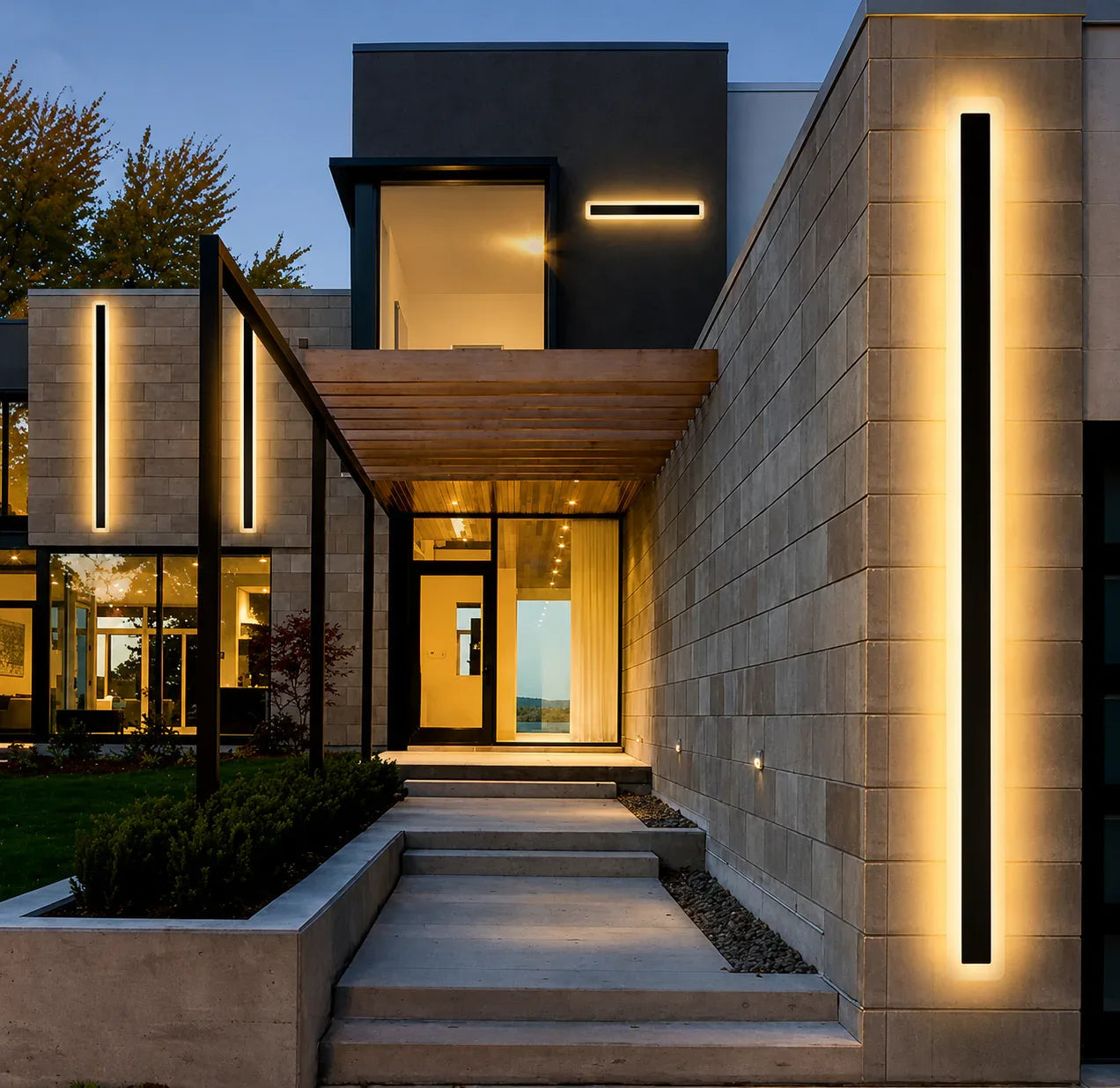 Modern house exterior with illuminated steps and walls at dusk