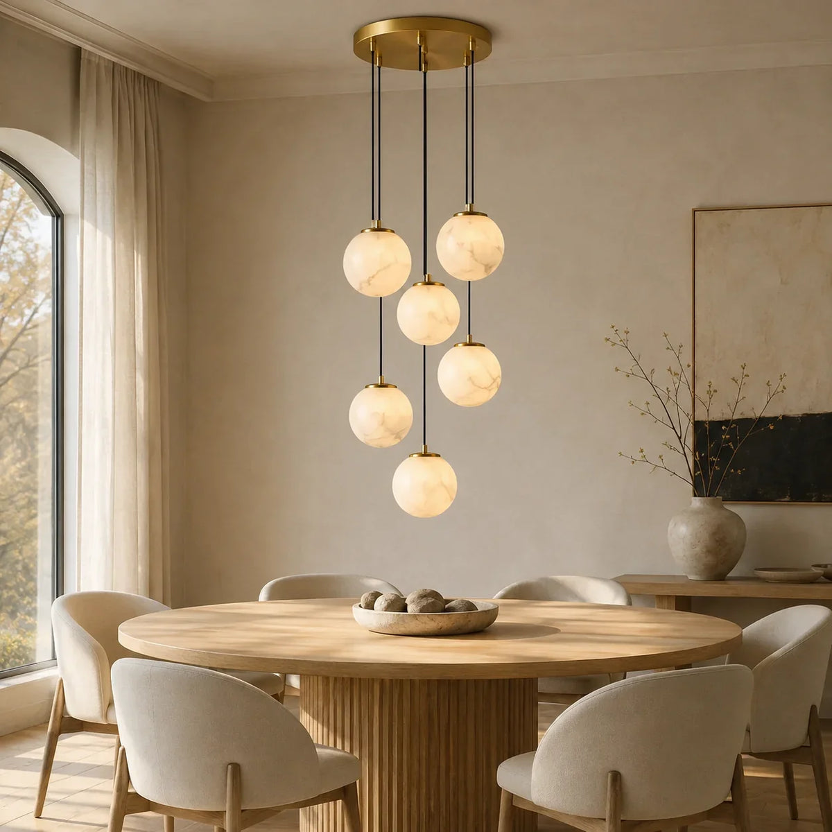 Solen Cascade Chandelier illuminating a modern living space with soft ambient globe lighting